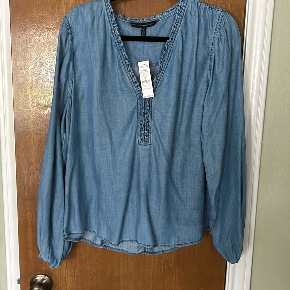 Woman’s blue long sleeve shirt. New with tags.